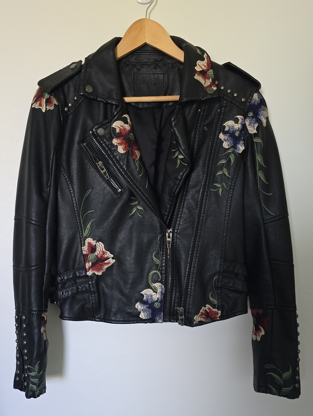 Blank NYC Black Vegan Leather Moto Jacket with Red & Blue Floral Embroidery